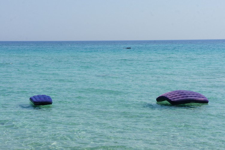 Airbeds floating on the Ocean